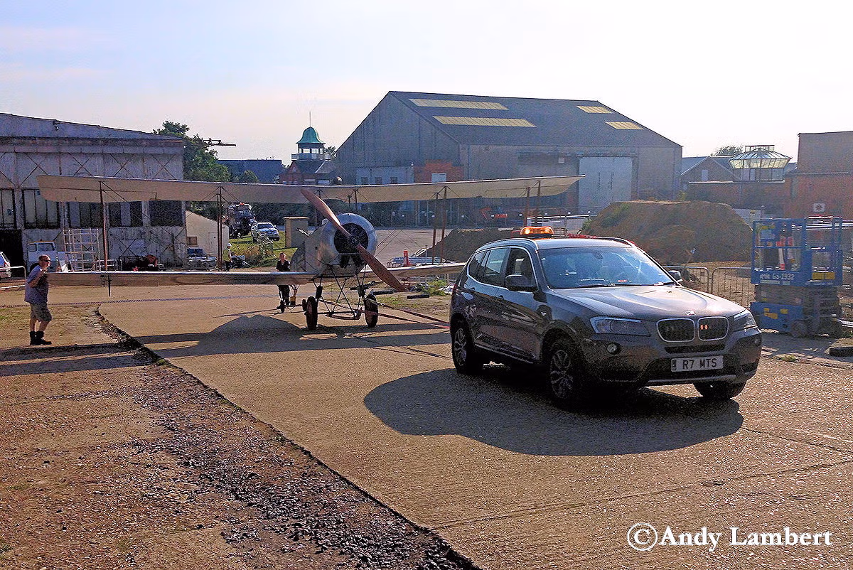 Towing the AVRO 504 biplane to the flight shed